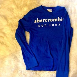 It’s a boy’s Abercrombie long sleeve shirt. Lightly worn